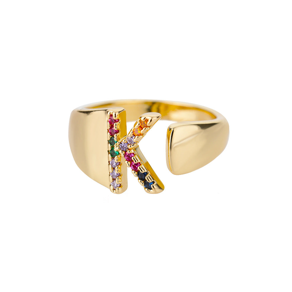 18K gold plated micro pave zircon letter ring with open design, featuring colorful gemstones and the letter "B" on a sleek band.