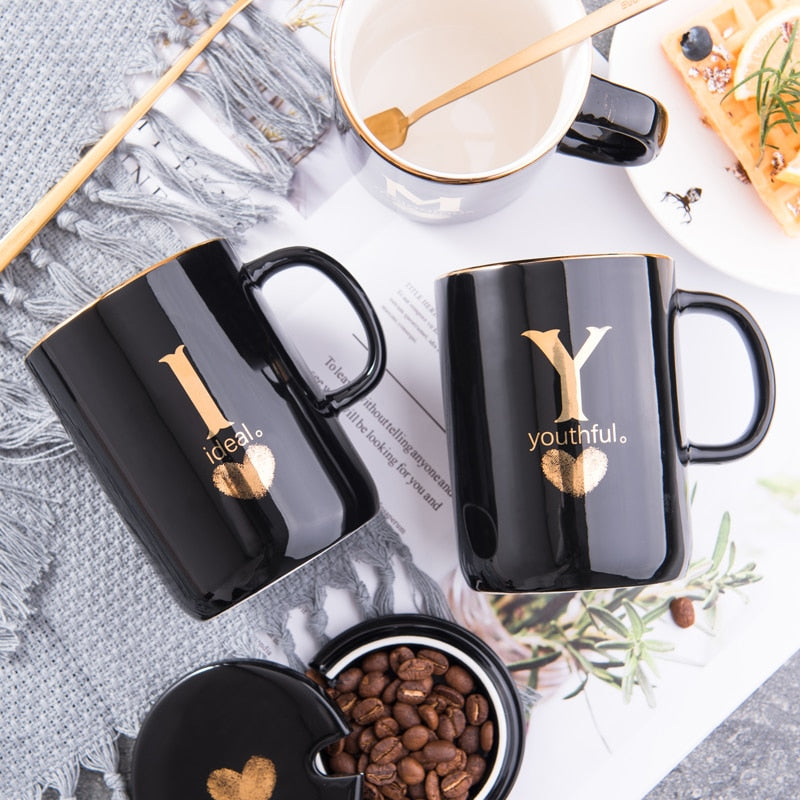 Eprolo 400ml black ceramic coffee mug with gold handle, lid, and spoon, featuring gold finger printing design for tea or coffee.