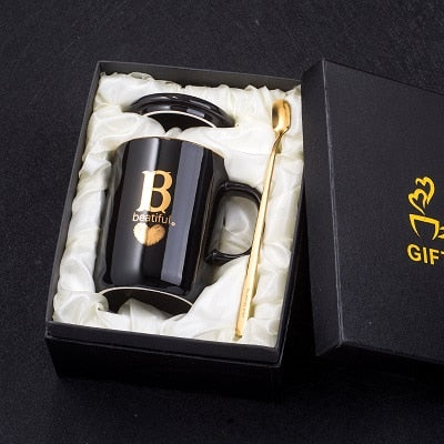 Eprolo 400ml black ceramic coffee mug with gold handle, lid, and spoon, featuring gold finger printing design, perfect for gifts.