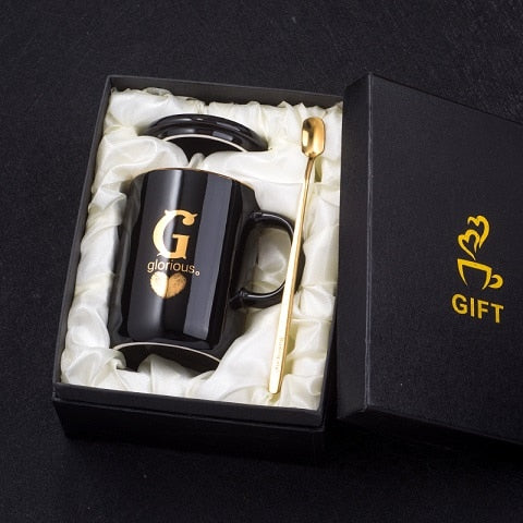Eprolo 400ml black ceramic coffee mug with gold handle, lid, and spoon, featuring a creative gold fingerprint design.