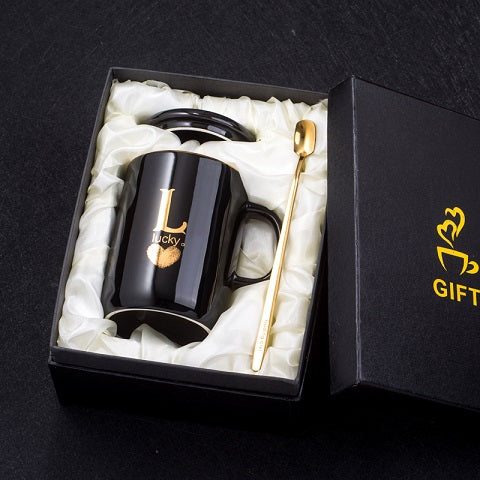 Creative black ceramic coffee mug with gold handle, lid, and spoon, 400ml capacity, by eprolo, ideal for tea or coffee.