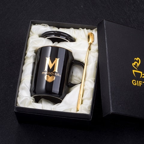 Eprolo 400ml black ceramic coffee mug with gold finger printing, gold handle, lid, and spoon, ideal for tea or coffee.