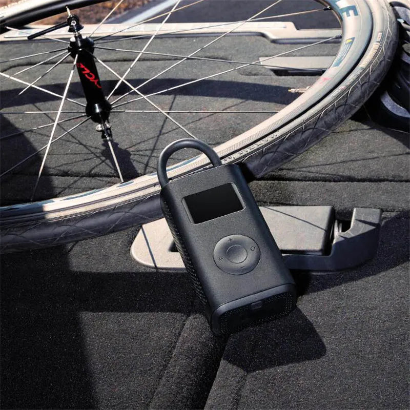Xiaomi Mijia portable digital tire inflator pump with digital pressure display for bikes, motorcycles, cars, and sports balls.