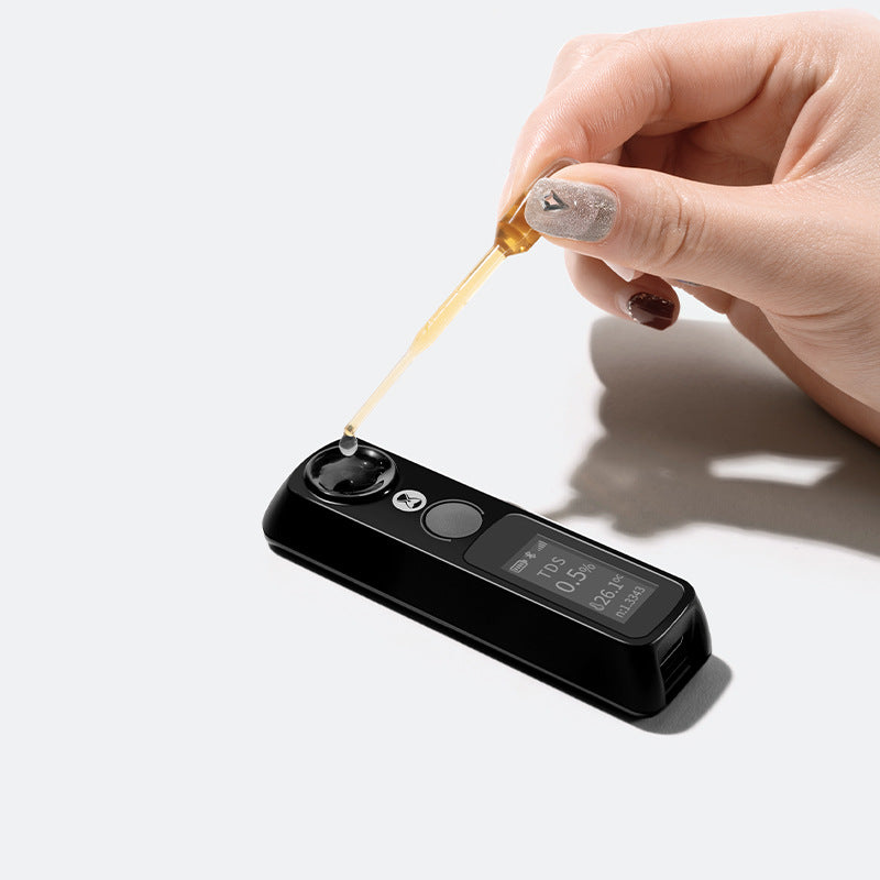 eprolo digital TDS coffee concentration tester showing a handheld device measuring coffee quality