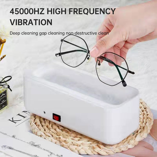 Small portable eprolo sonic wave cleaning machine with electric ultra frequency and compact design for household use.