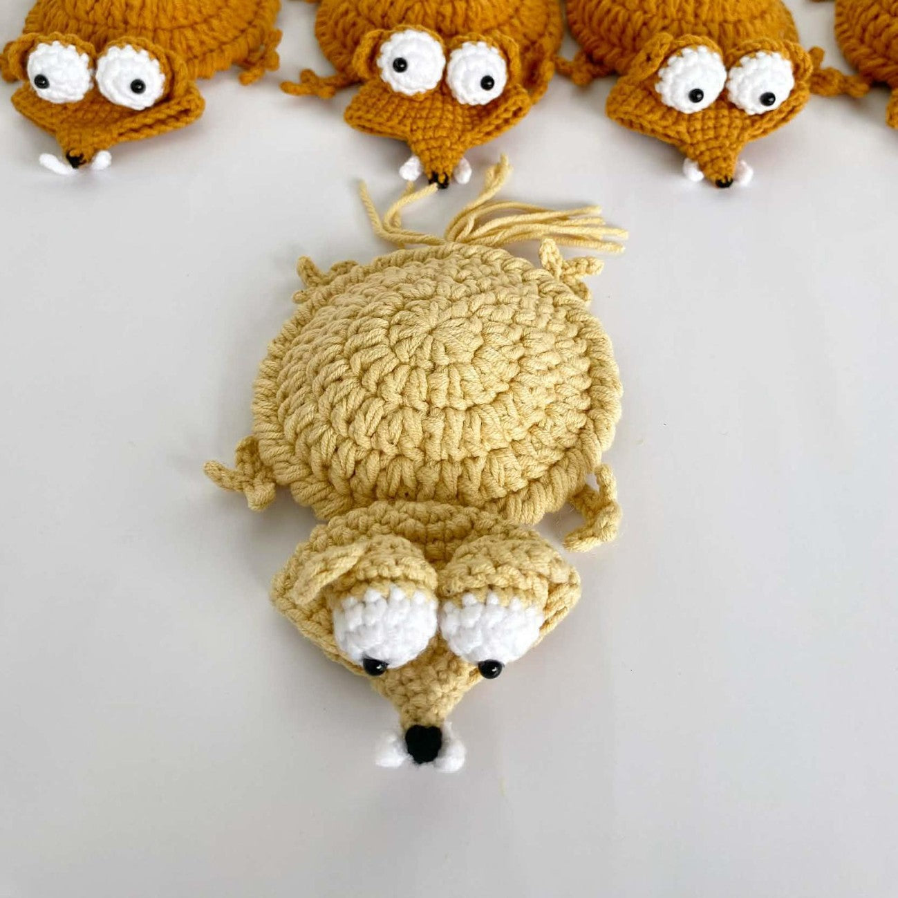 Handmade crochet animal coasters featuring a turtle and squirrel design, heat-insulating pads for creative desk decor.