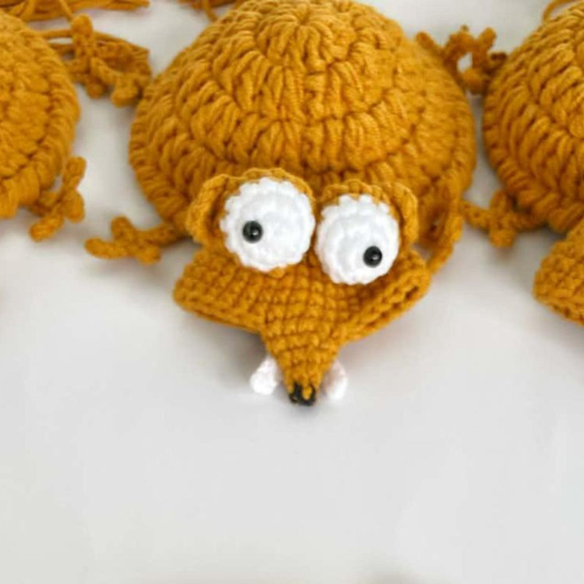 Handmade crochet animal coasters featuring a turtle and squirrel, heat-insulating pads for creative desk and home decor.