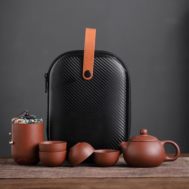 Purple ceramic sand tea cups set with portable teapot, ideal for outdoor travel and traditional Kung Fu tea ceremonies.