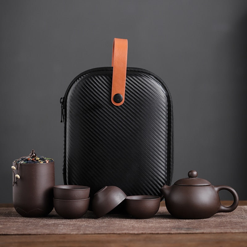 Purple ceramic sand tea cups and portable teapot set for outdoor travel, ideal for traditional Kung Fu tea ceremony.
