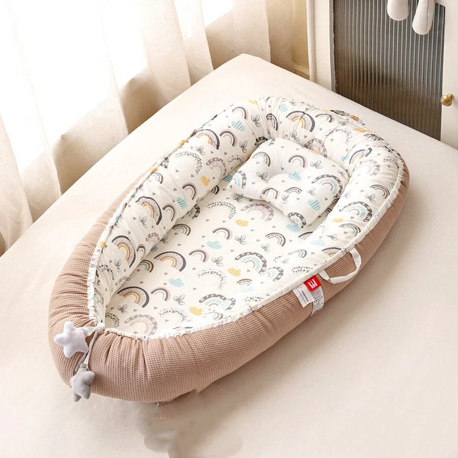 Eprolo portable baby crib with removable, washable pillow, designed for travel and comfort for infants.