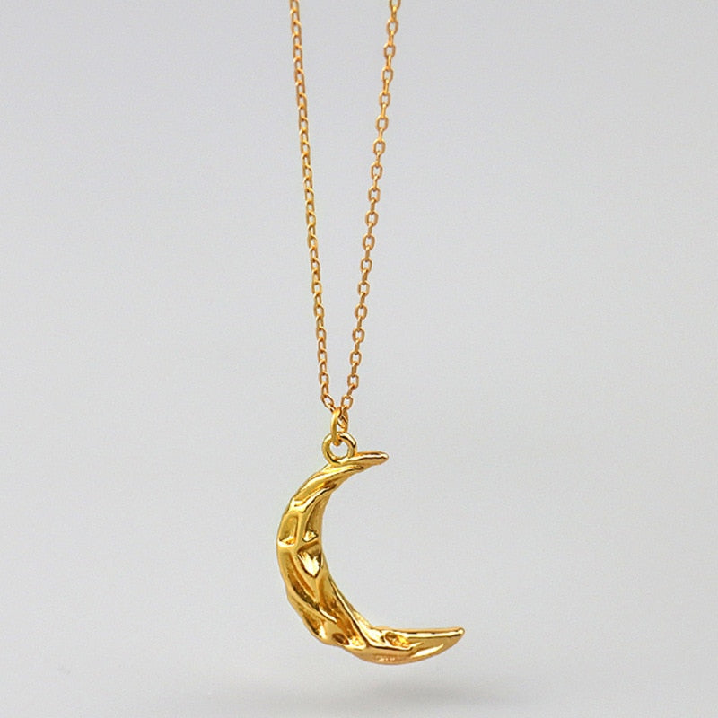 Vintage Moon Necklace by eprolo featuring a detailed silver moon pendant on a delicate chain.