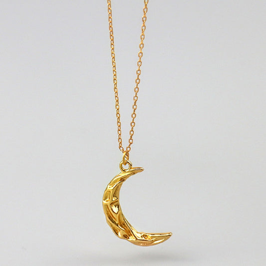 Vintage Moon Necklace by eprolo featuring a detailed silver moon pendant on a delicate chain.