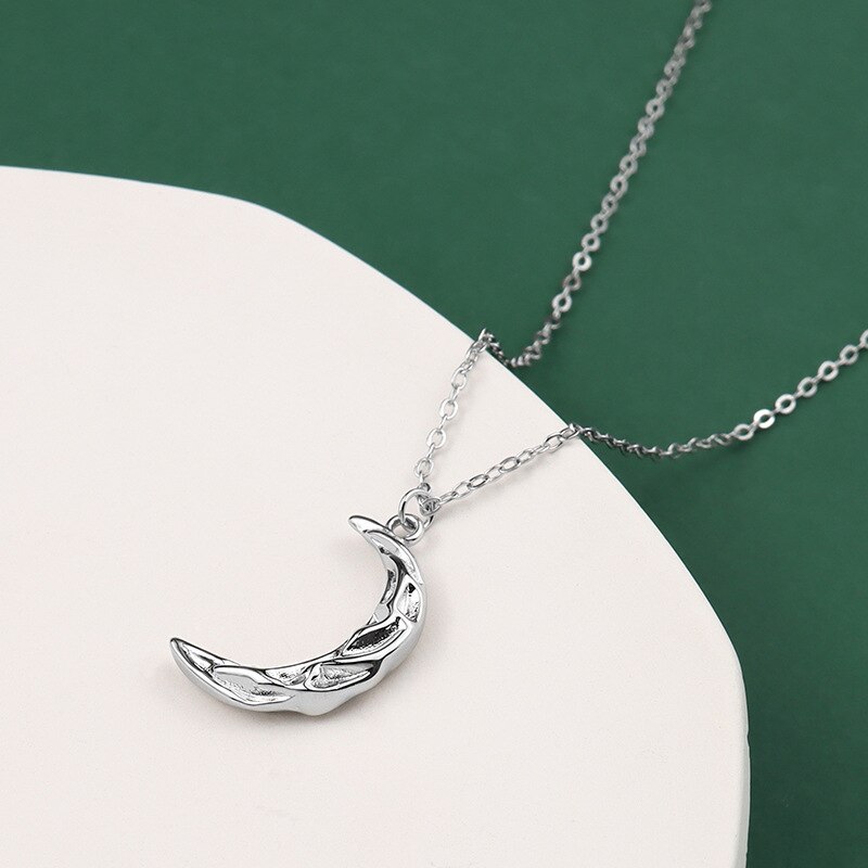Vintage moon necklace with silver chain and crescent moon pendant, stylish jewelry accessory by eprolo.