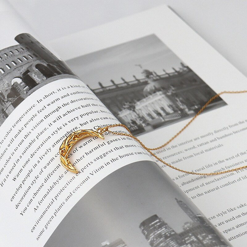 Vintage moon necklace with celestial pendant, featuring a detailed silver-tone design, by eprolo.