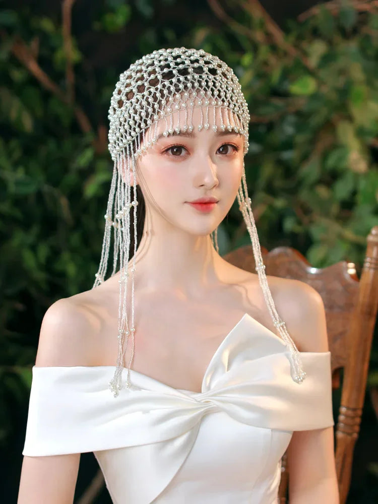 Handmade hollowed-out headpiece with pearl tassels, performance hat by eprolo, featuring intricate design and elegant craftsmanship.