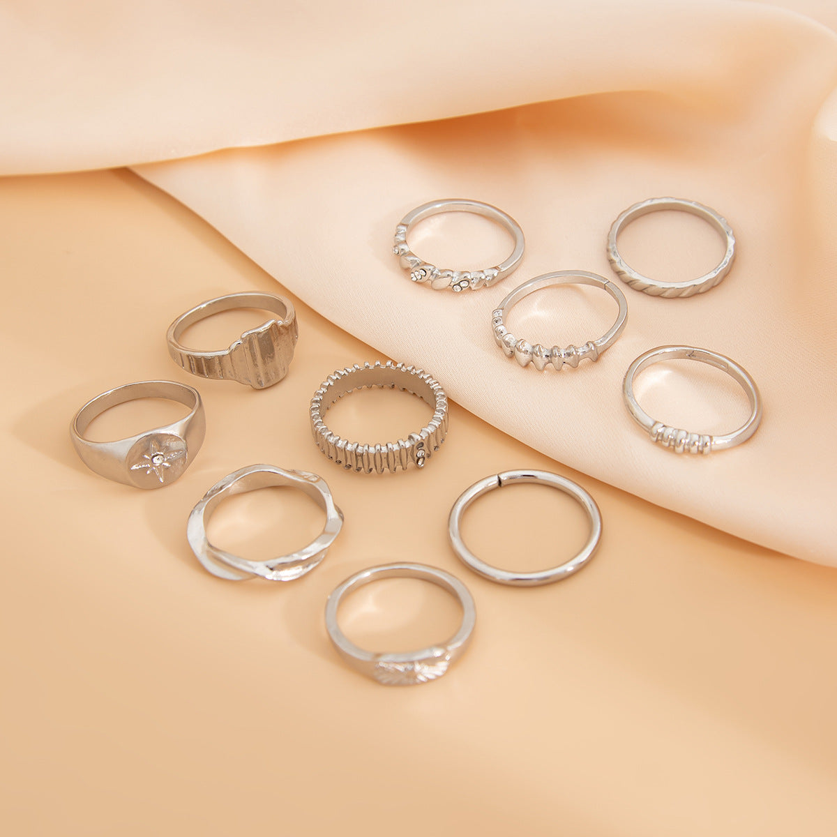 Vintage irregular gear ring with diamond accents and metallic geometric rings, versatile jewelry piece by eprolo.