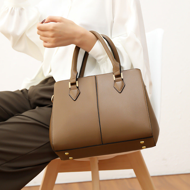 Elegant mid-aged women's handbag by eprolo featuring a classic tote style, suitable for mothers and ladies.