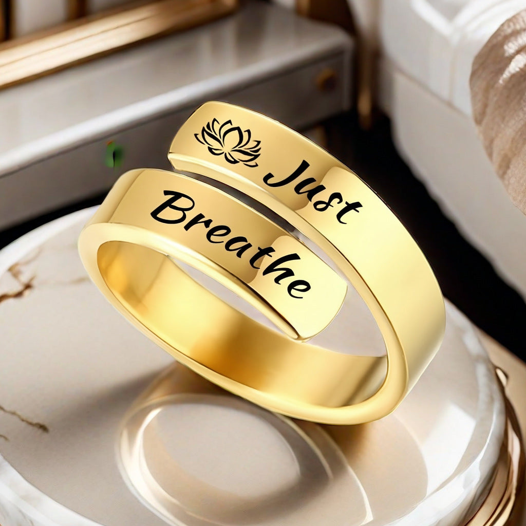 Titanium steel women's open mouth jewelry ring with "Just Breathe" engraving and lotus design, suitable for men.