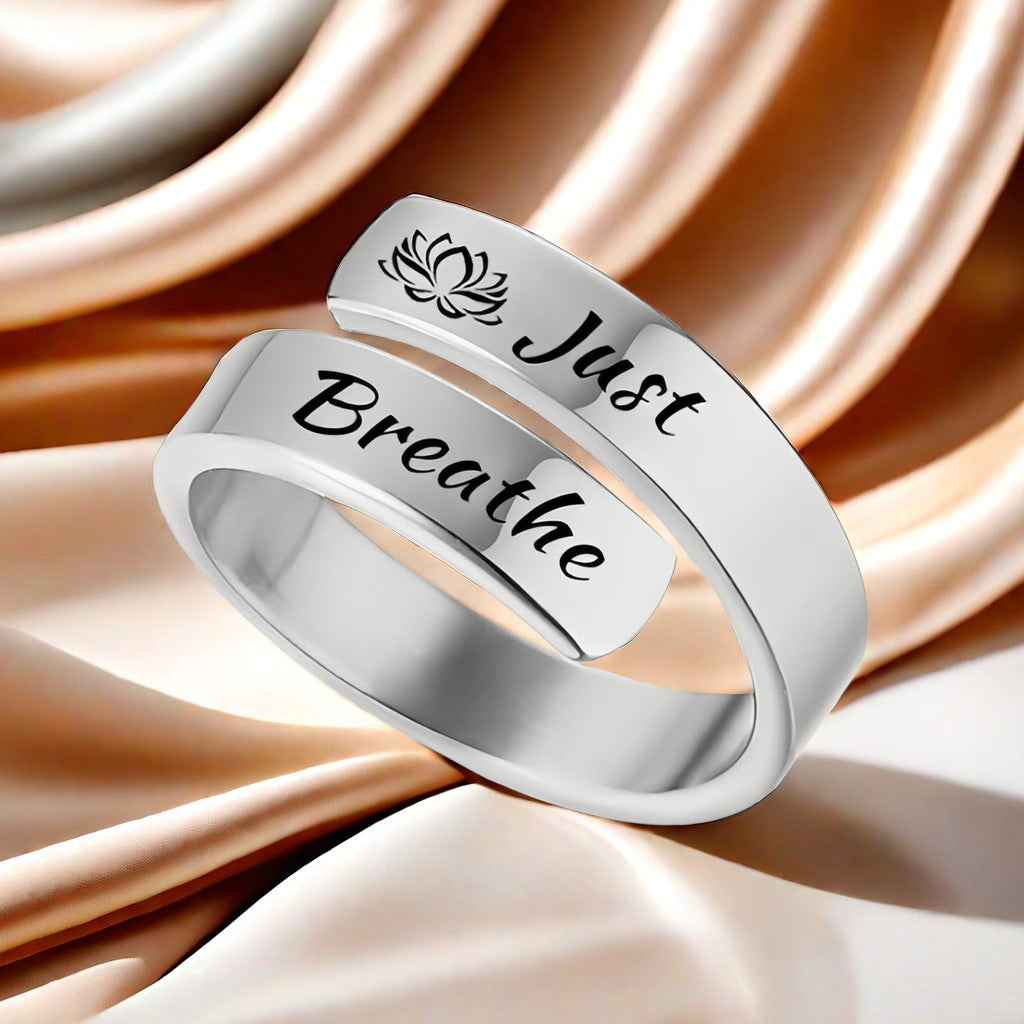 Titanium steel letter ring engraved with "Just Breathe" and lotus design, open mouth jewelry for women and men by eprolo.
