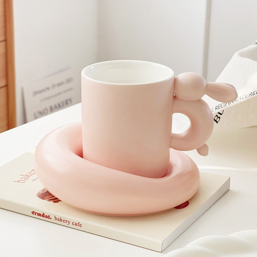 Eprolo rabbit-themed ceramic coffee cup with matching saucer set, ideal for afternoon tea and stylish table settings.