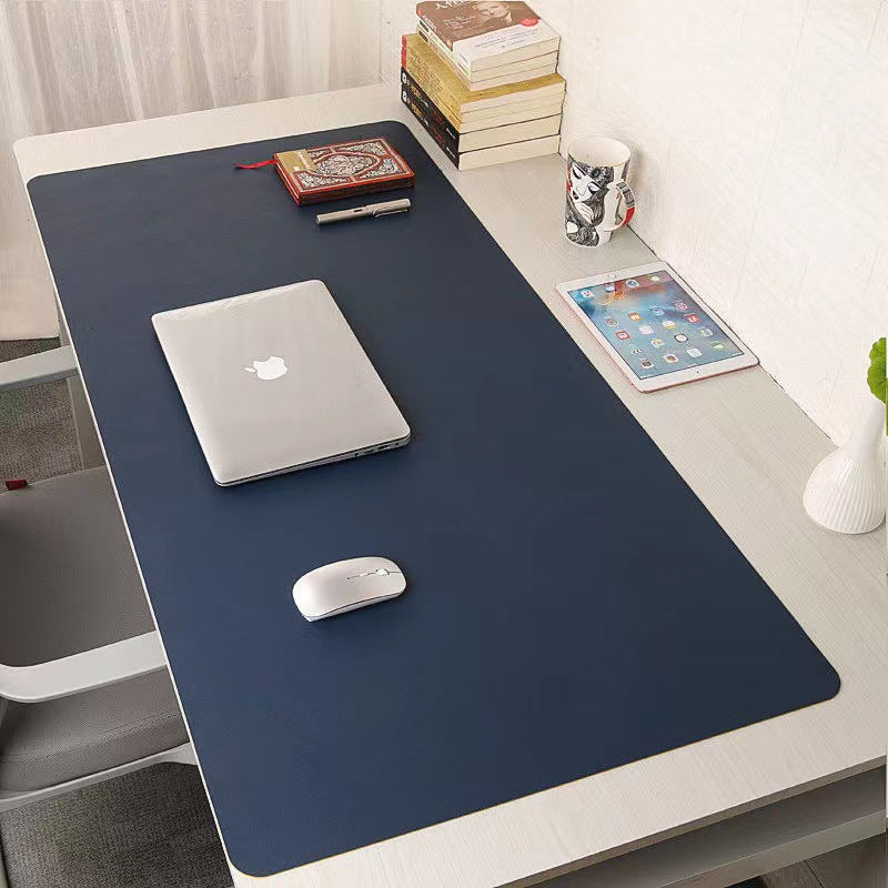 Large waterproof PU leather office desk protector mat with mouse pad and keyboard space, ideal for gaming and work setups