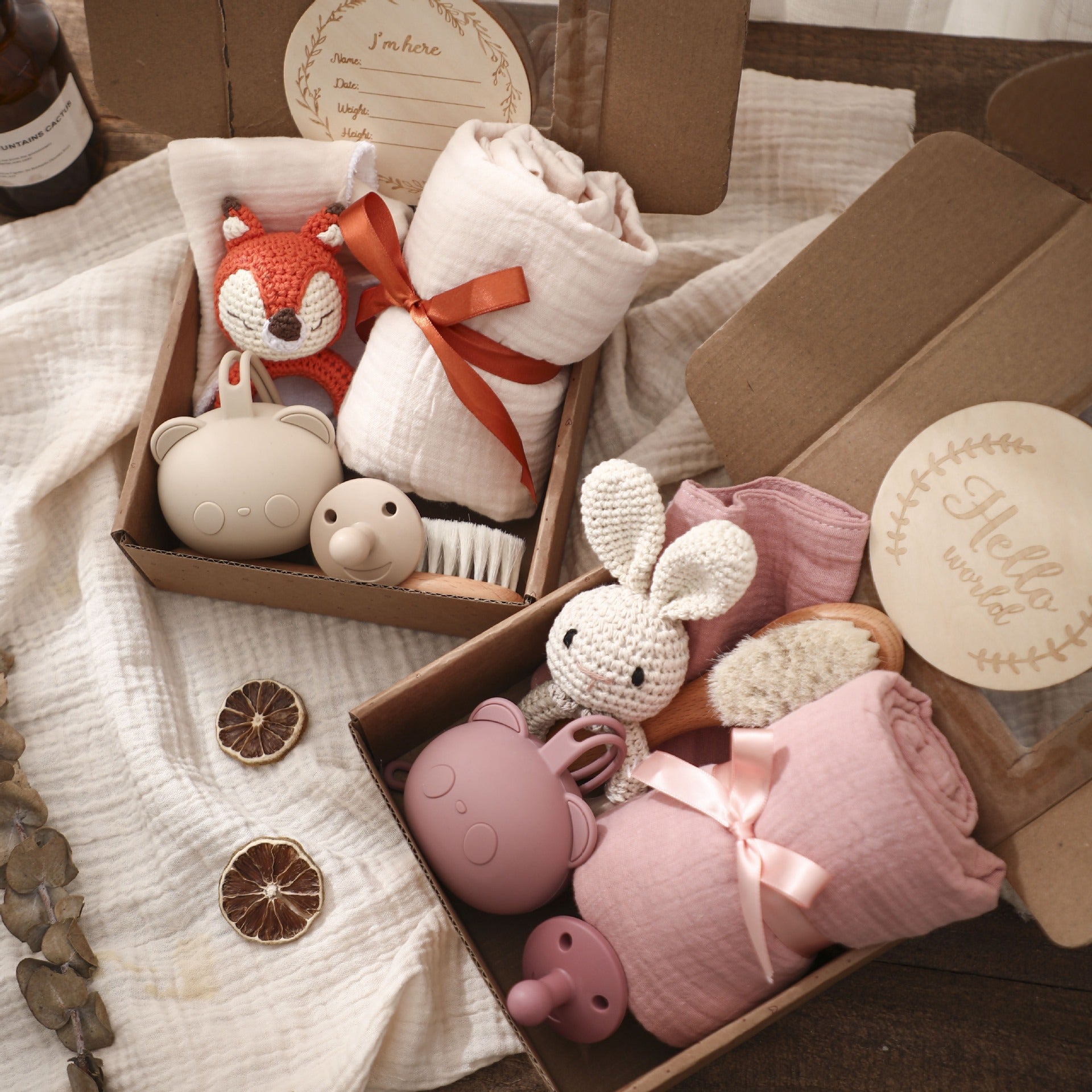 Eprolo full moon birth gift set with hand towel, wool brush, water towel, pacifier, and baby shower items arranged on a surface.
