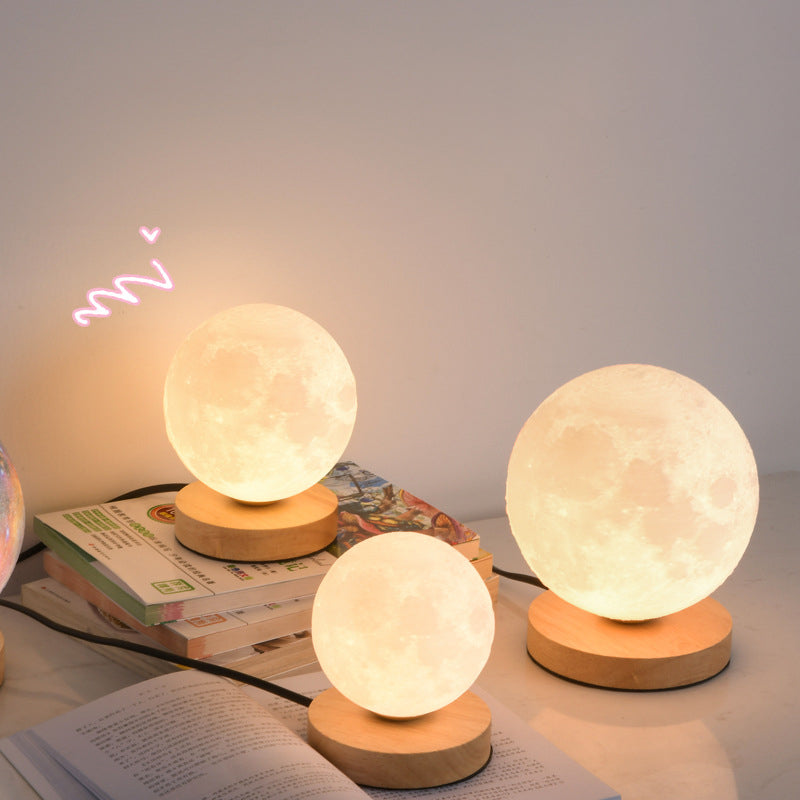 Eprolo 3D moon lamp on bedside table, glowing with warm light, creative moon-shaped desk and night lamp for bedroom decor.