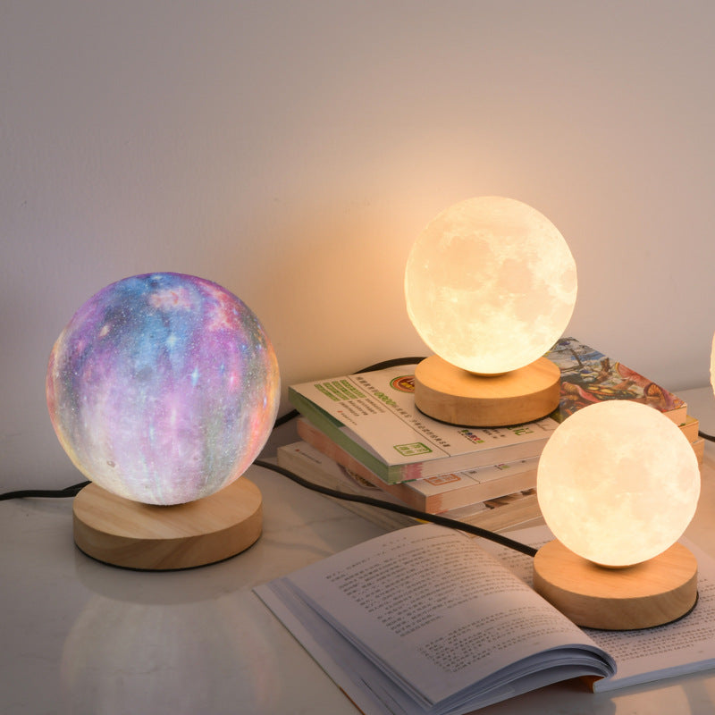 Eprolo 3D Moon Lamp on bedside table, glowing with soft light, creative moon-shaped desk lamp for bedroom and night ambiance.
