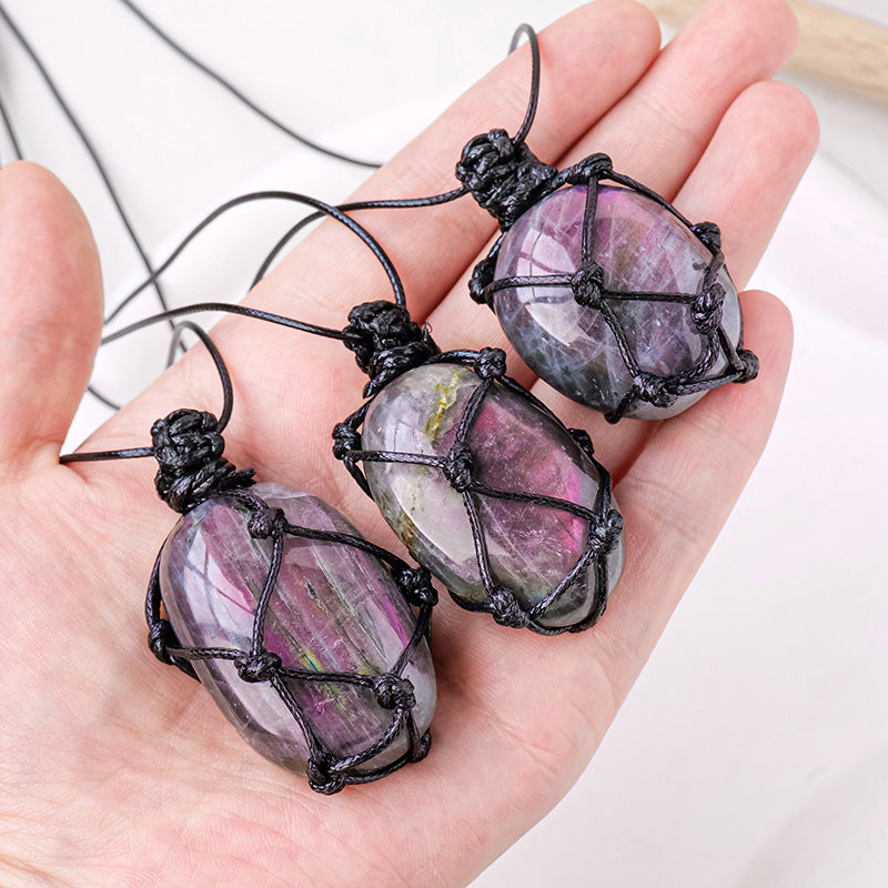 Purple light feldspar raw stone pendant necklace with moonstone-shaped crystal in a handmade mesh bag, by eprolo.