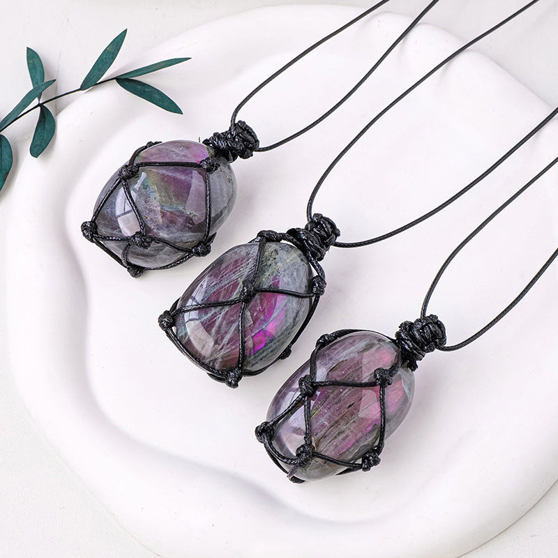 Purple light feldspar raw stone pendant necklace with moonstone shape crystal and handmade mesh bag design on a silver chain.