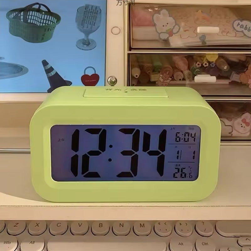 eprolo mini digital alarm clock with LED backlight, calendar, snooze, and data display showing time and date.