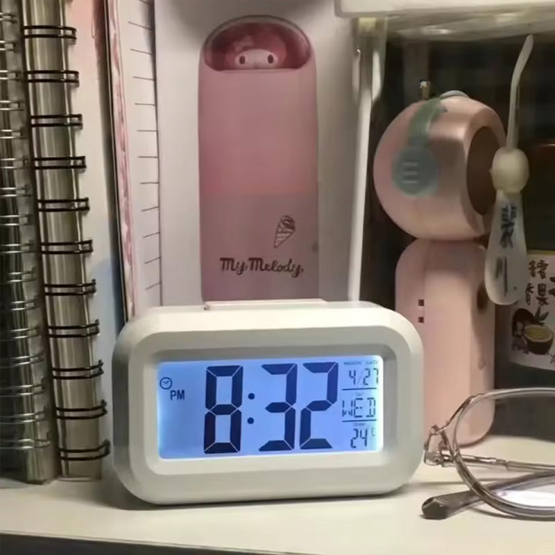 Mini digital alarm clock with LED backlight, calendar display, snooze button, and data readout by eprolo.