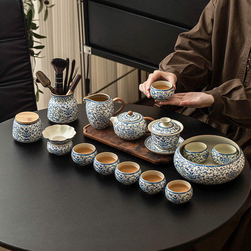 Blue and white ceramic Kung Fu tea set with lotus design, includes teapot, fair cup, tea can, lid, and bowl by eprolo