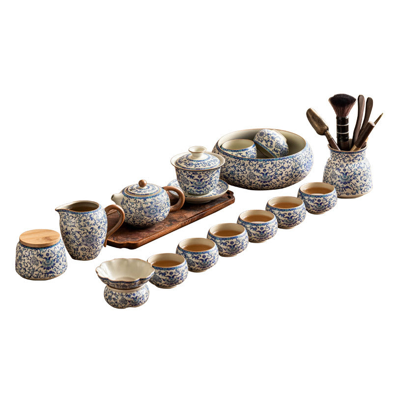 Blue and white ceramic Kung Fu tea set with lotus design, includes teapot, fair cup, tea can, lid, and bowl from Eprolo.