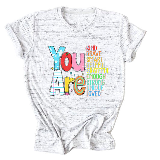 Women’s funny summer T-shirt by eprolo with short sleeves, featuring playful text about being kind, brave, and smart.
