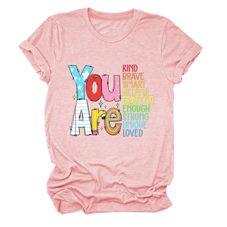 Women's funny summer T-shirt by eprolo with short sleeves, featuring playful text celebrating kindness, bravery, and intelligence.
