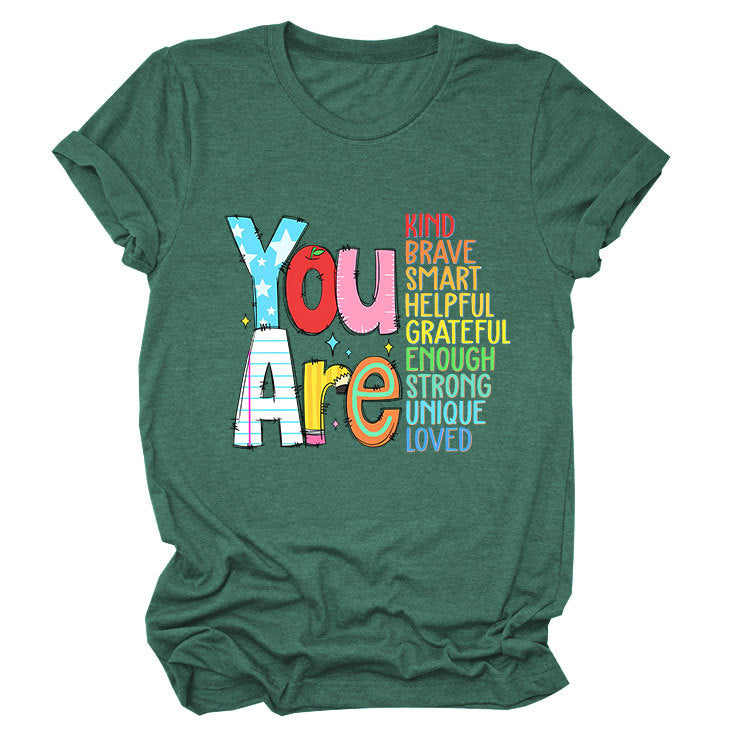 Women’s funny summer T-shirt by eprolo with short sleeves, featuring playful text that highlights kindness, bravery, and intelligence.