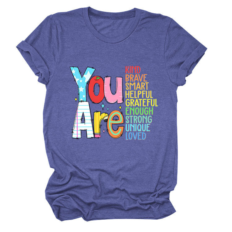 Women’s funny summer T-shirt by eprolo with bright, bold text showcasing kindness, bravery, and intelligence, short-sleeved casual tee.