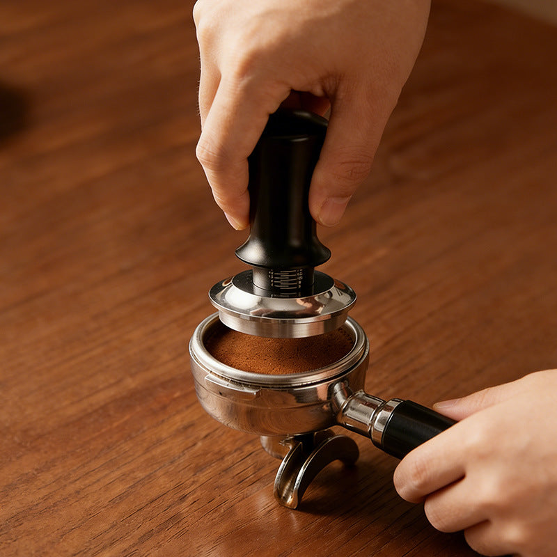 Eprolo 304 stainless steel adjustable coffee tamper with built-in scale for precise espresso tamping, shown on a coffee countertop.