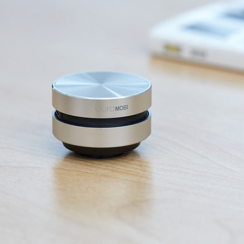 Hummingbird portable bone conduction resonance speaker by eprolo, showing the compact device with metal and plastic components.