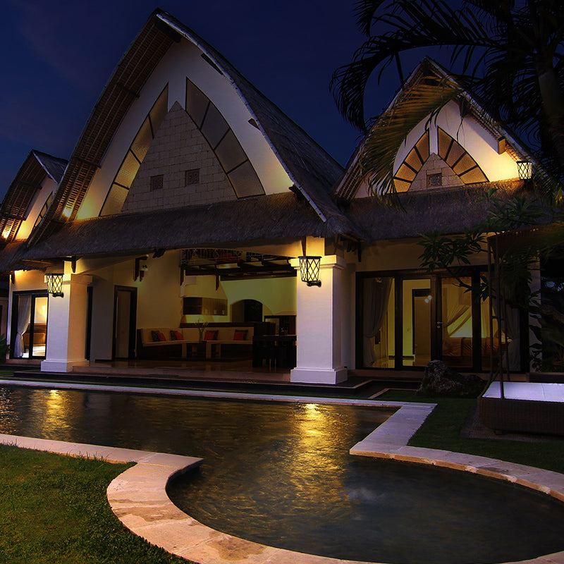 Solar LED flame light by eprolo illuminating outdoor villa garden with a warm, flickering flame-style solar garden wall and floor lamp.