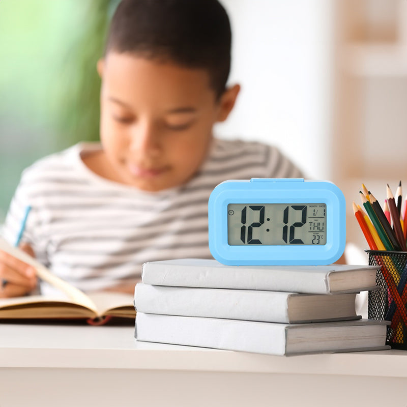 eprolo digital LED alarm clock with battery power, display, and multi-function features on a bedroom bedside table.