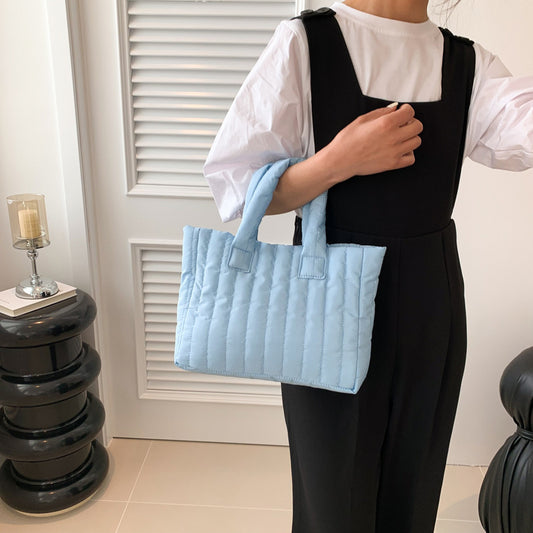 Large capacity eprolo tote bag with cotton shoulder strap, featuring simple embroidery and a unique handheld design.