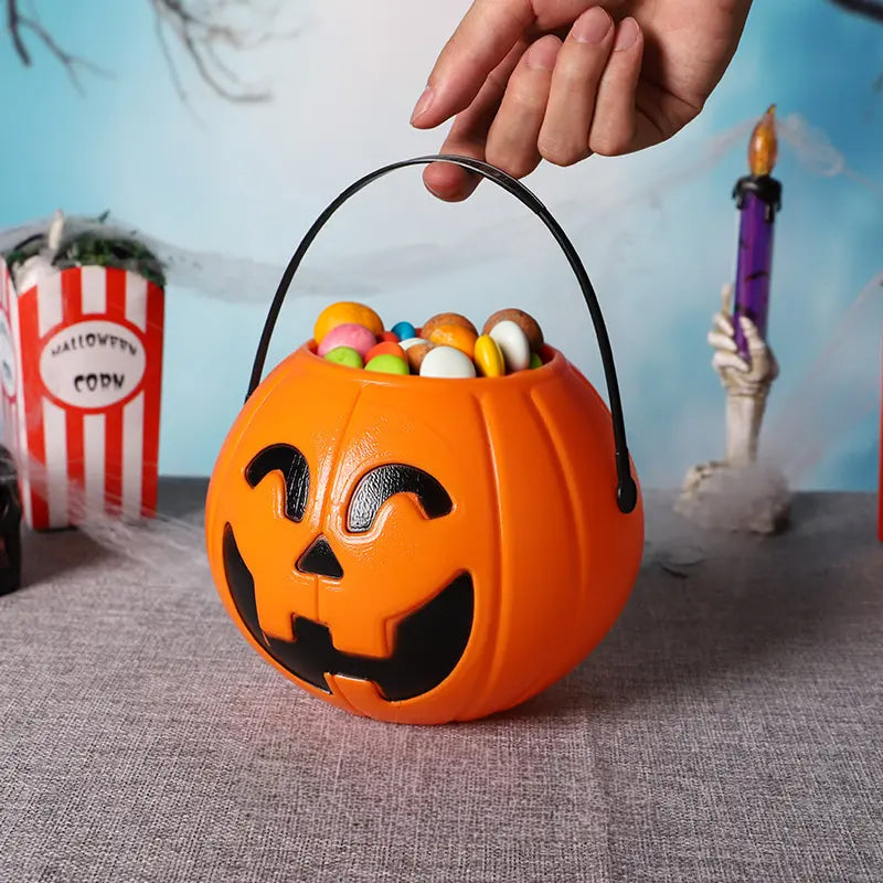Three plastic Halloween pumpkin buckets with handles, designed for kids' trick-or-treating and Halloween home decor by eprolo.